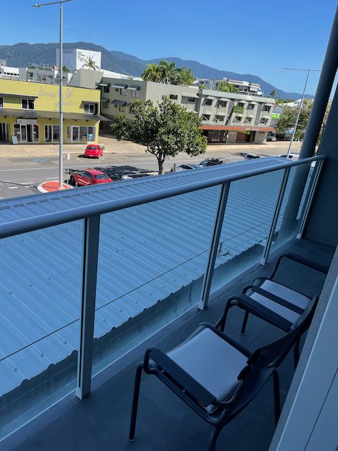 View of ym balcony, with a couple of chairs.  About one metre wide and three metres long.